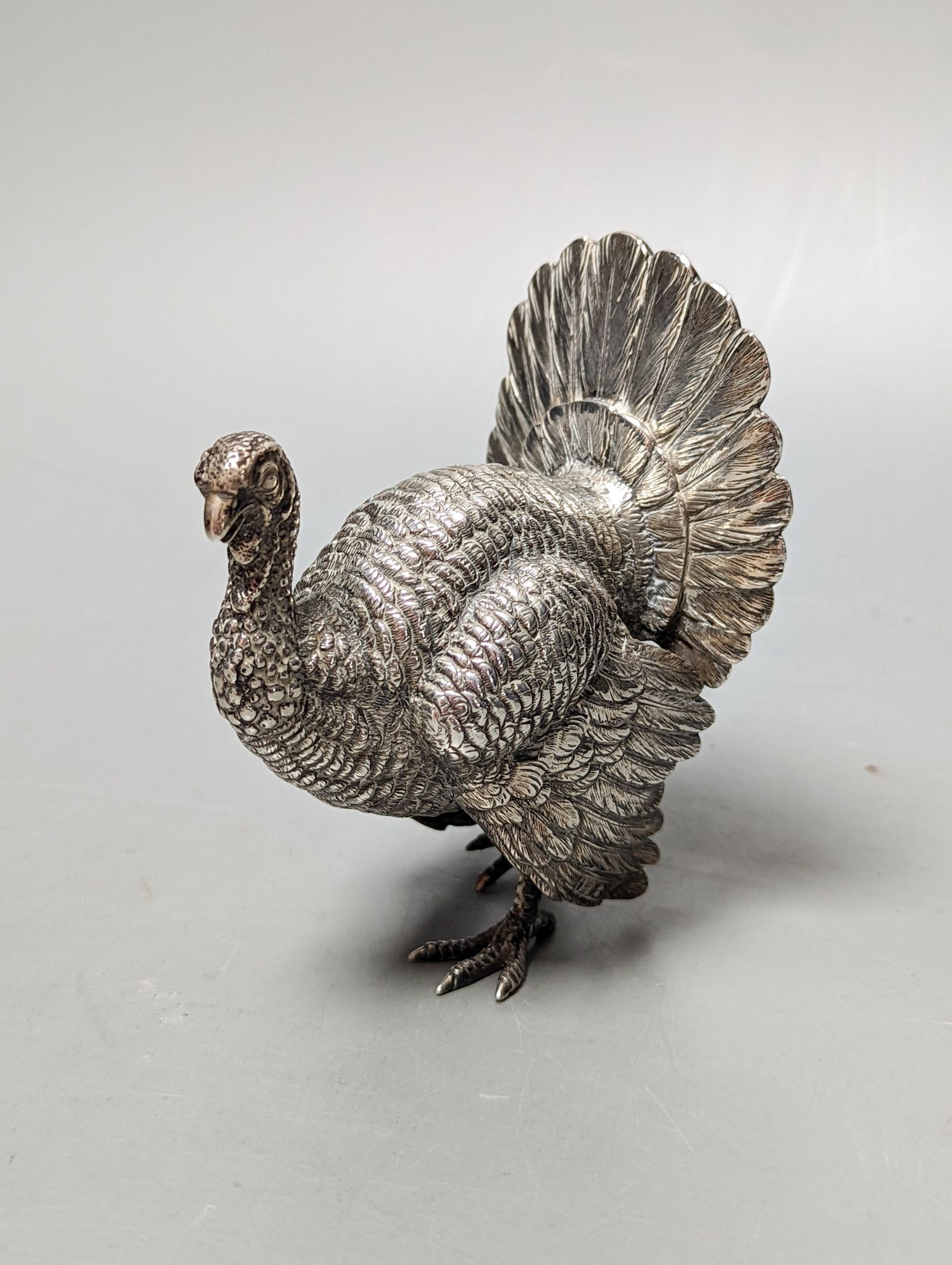 A late 19th /early 20th century Hanau silver free standing model of a game bird, 1930's import marks, height 10.4cm, 180 grams.